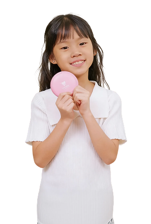 Girl smiling while holding clear aligner case from Dr Clear Aligners Junior