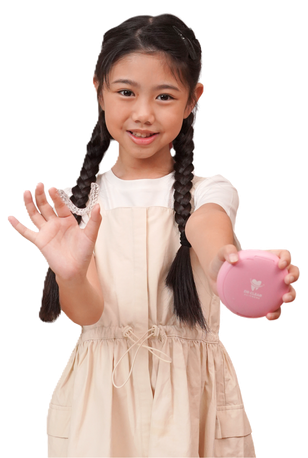 Young girl holding Dr Clear Aligners Junior clear aligner and case