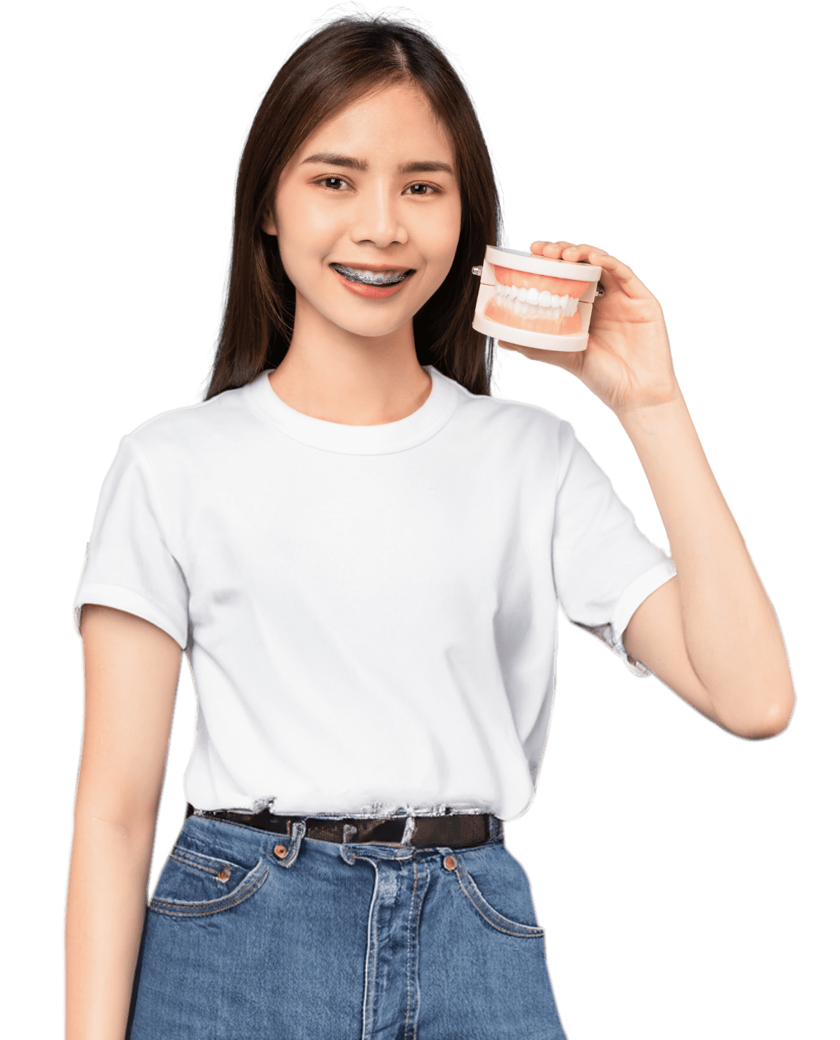 Young woman with metal braces holding a dental model, representing traditional orthodontic treatment