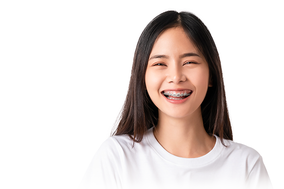 Smiling woman with traditional metal braces for orthodontic correction