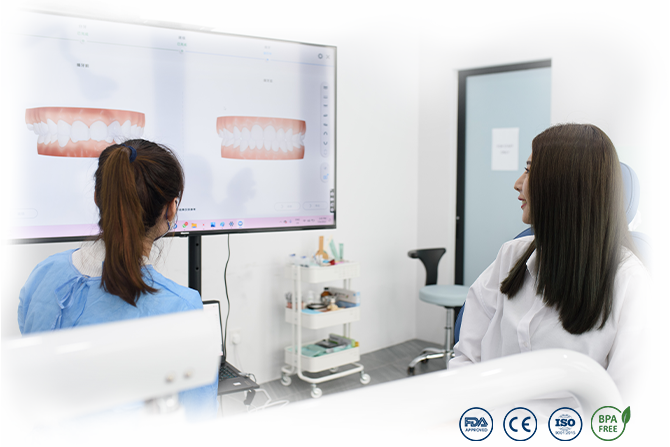 Orthodontist showing digital teeth alignment simulation to patient during consultation at Dr Clear Aligners Malaysia