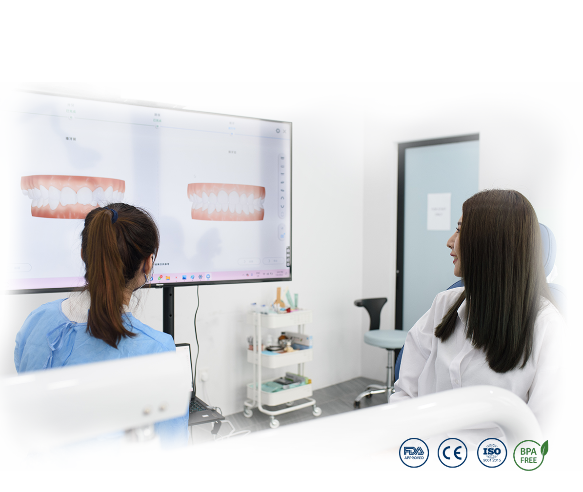 Orthodontist showing digital teeth alignment simulation to patient during consultation at Dr Clear Aligners Malaysia